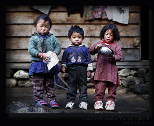 3 Nepali Khumbu kids outside their house, early morning