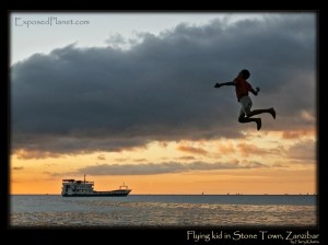 Flying kid on Stone Town, Zanzibar Tanzania