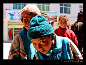 Curious Tibetan kids, wondering how that camera works
