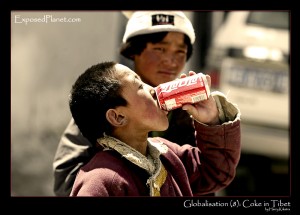 globalisation(8) Tibetan boy drinking Coca Cola, by Harry Kikstra on ExposedPlanet.com
