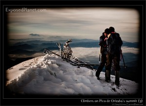 Climbers hugging on the summit of Pico de Orizaba, Mexico. (c) Harry Kikstra, ExposedPlanet.com